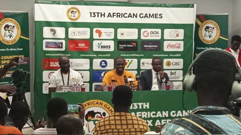 Minister of Youth & Sports Mustapha Ussif (sitting in the middle) addressing the media