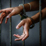 Prisoner in prison with handcuff